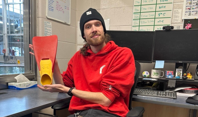 YMCA staff member holding a fin