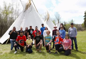 Indigenous team tipi raising