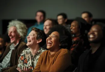 An audience of people enjoy a live performance 