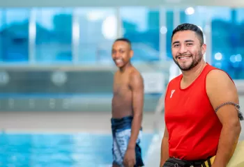 Lifeguard and kid at the pool