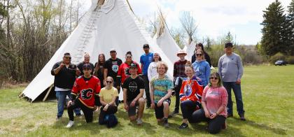 Indigenous team tipi raising