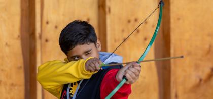boy shooting arrow