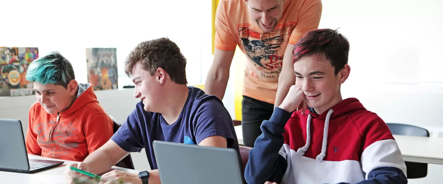group of youth working on computers