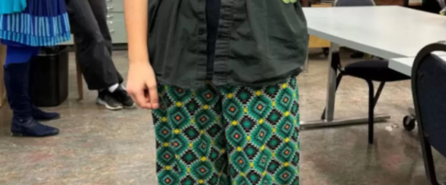 A youth wearing ribbon pants