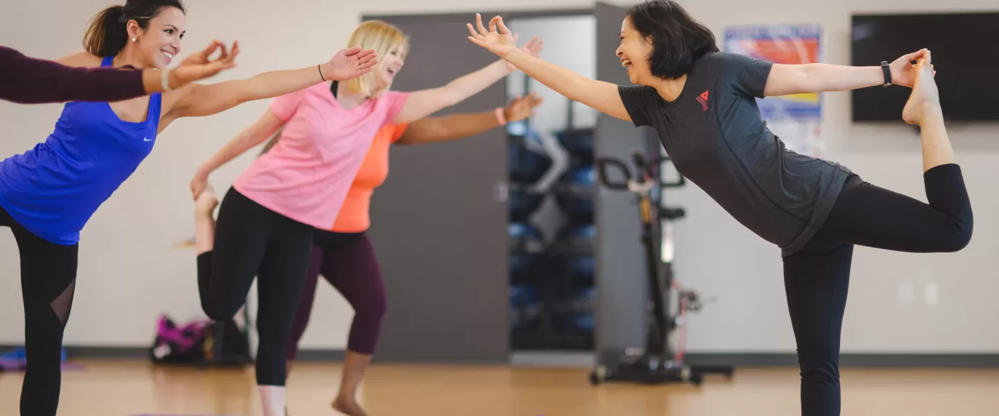 YMCA volunteer teaching group yoga class
