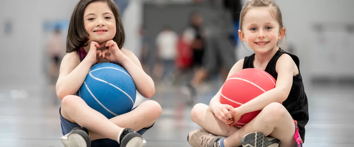 Young girls playing in gymnasium