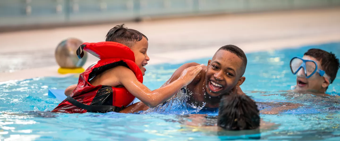 Group of boys swimming in the pool