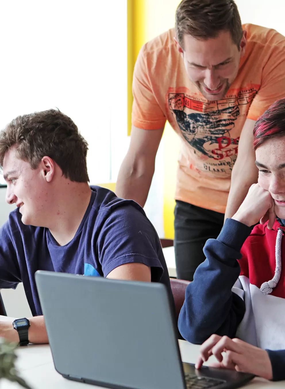 group of youth working on computers