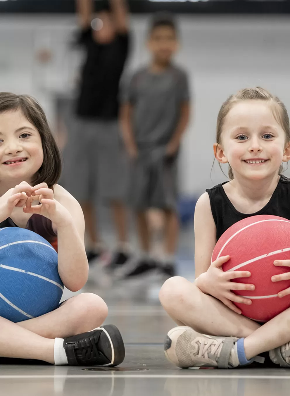 young girls playing in gymnasium