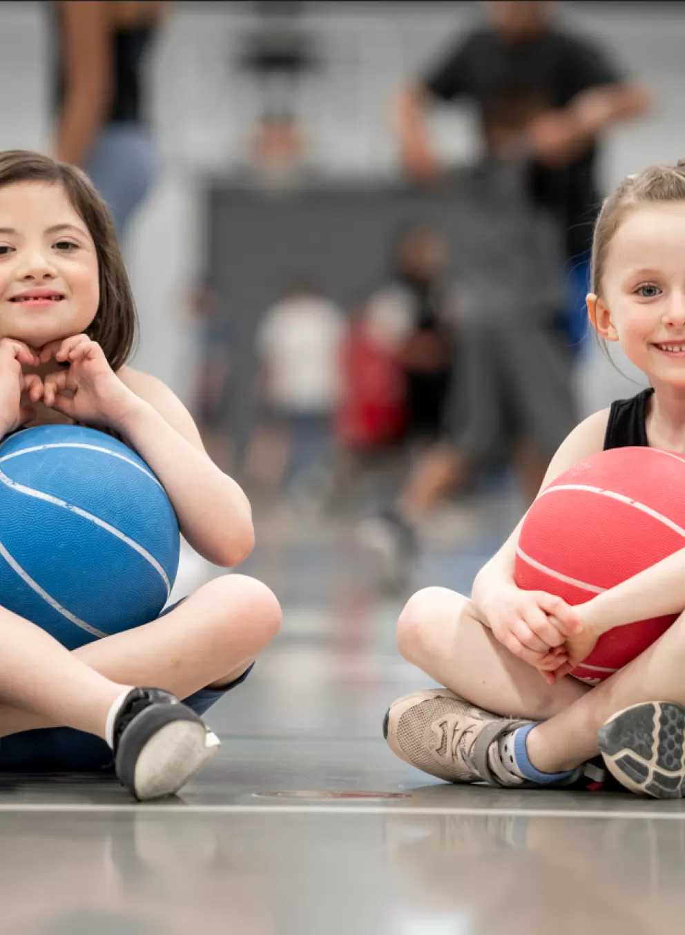 Young girls playing in gymnasium