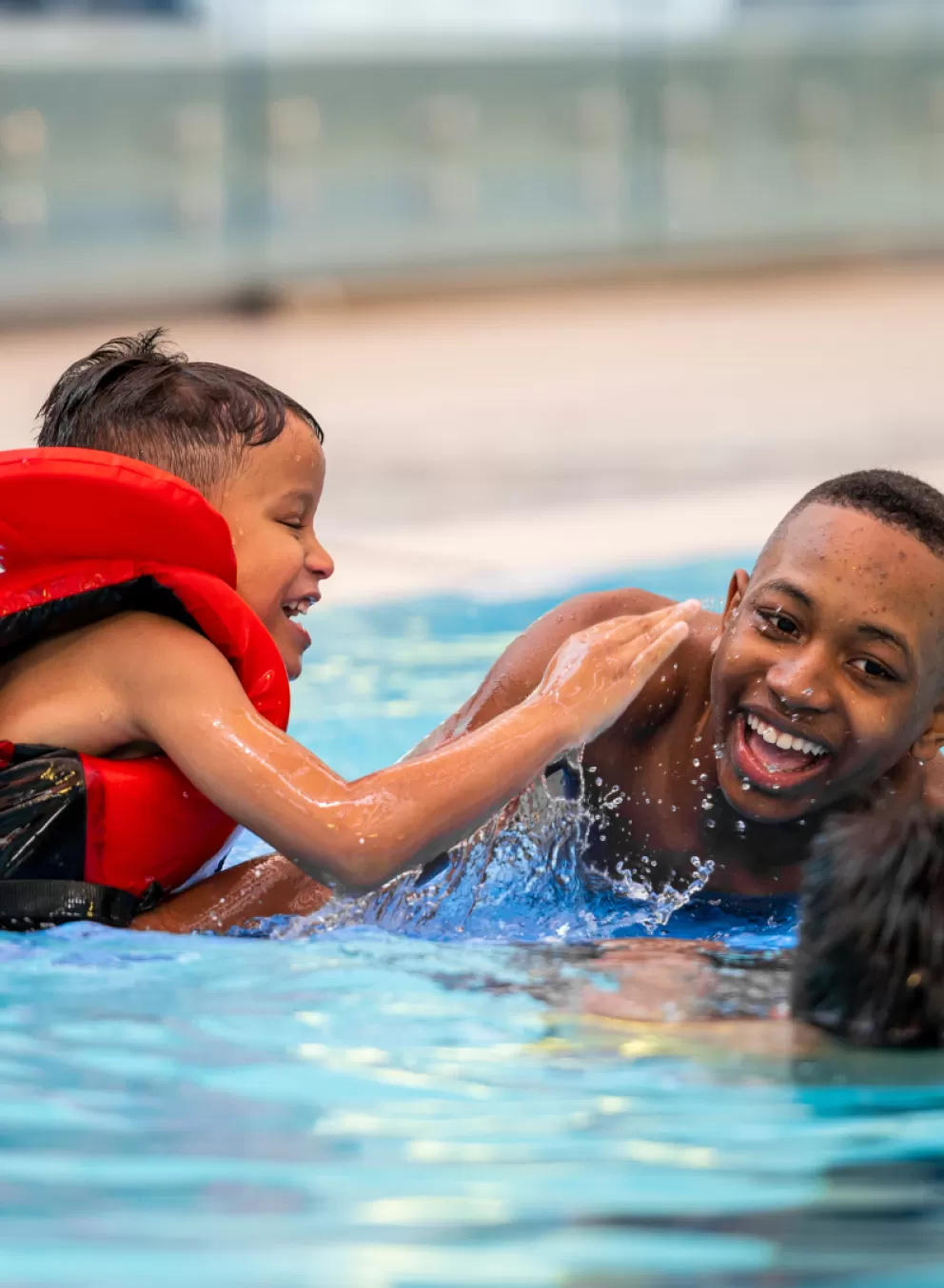 Group of boys swimming in the pool