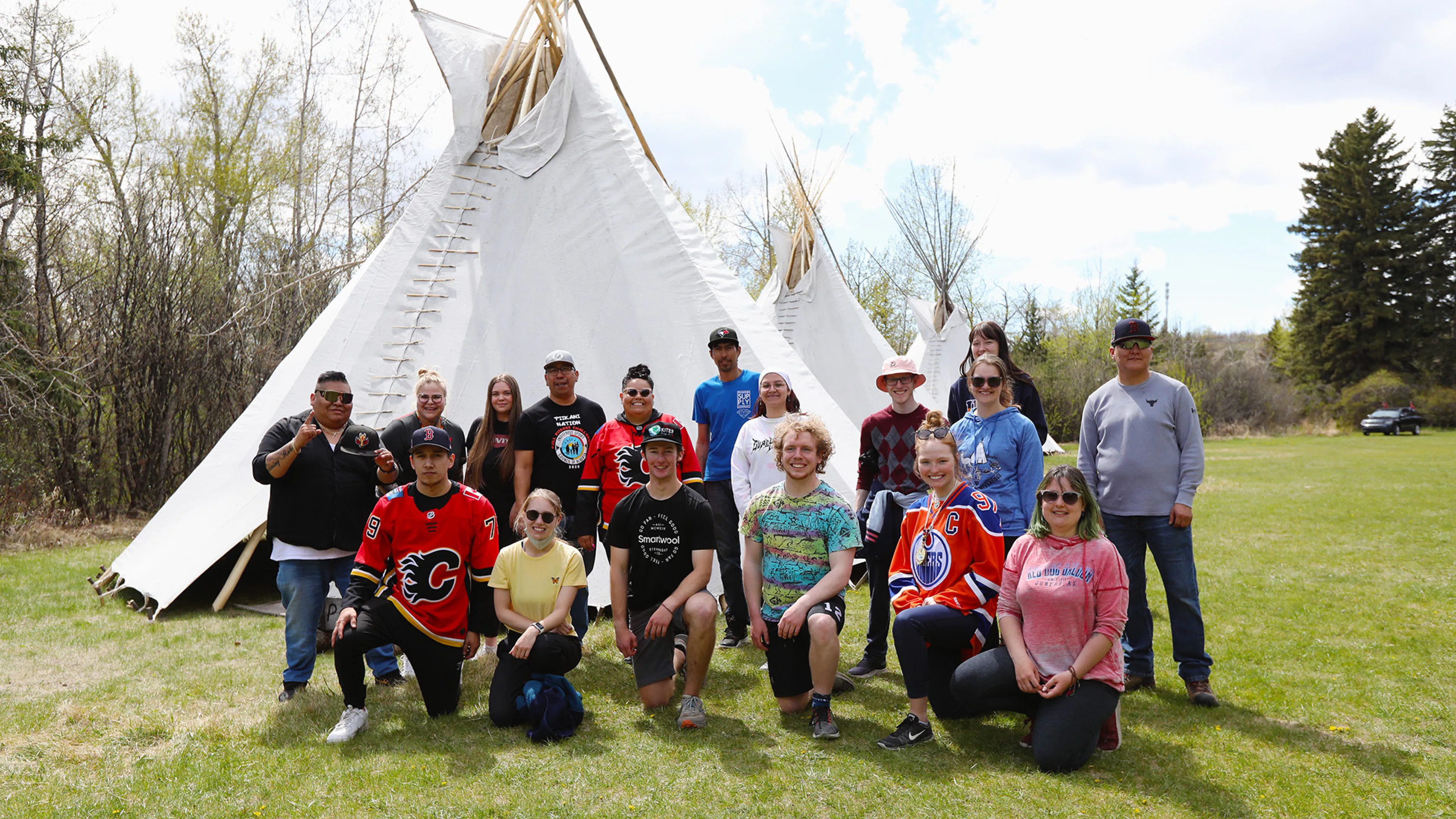 Indigenous team tipi raising
