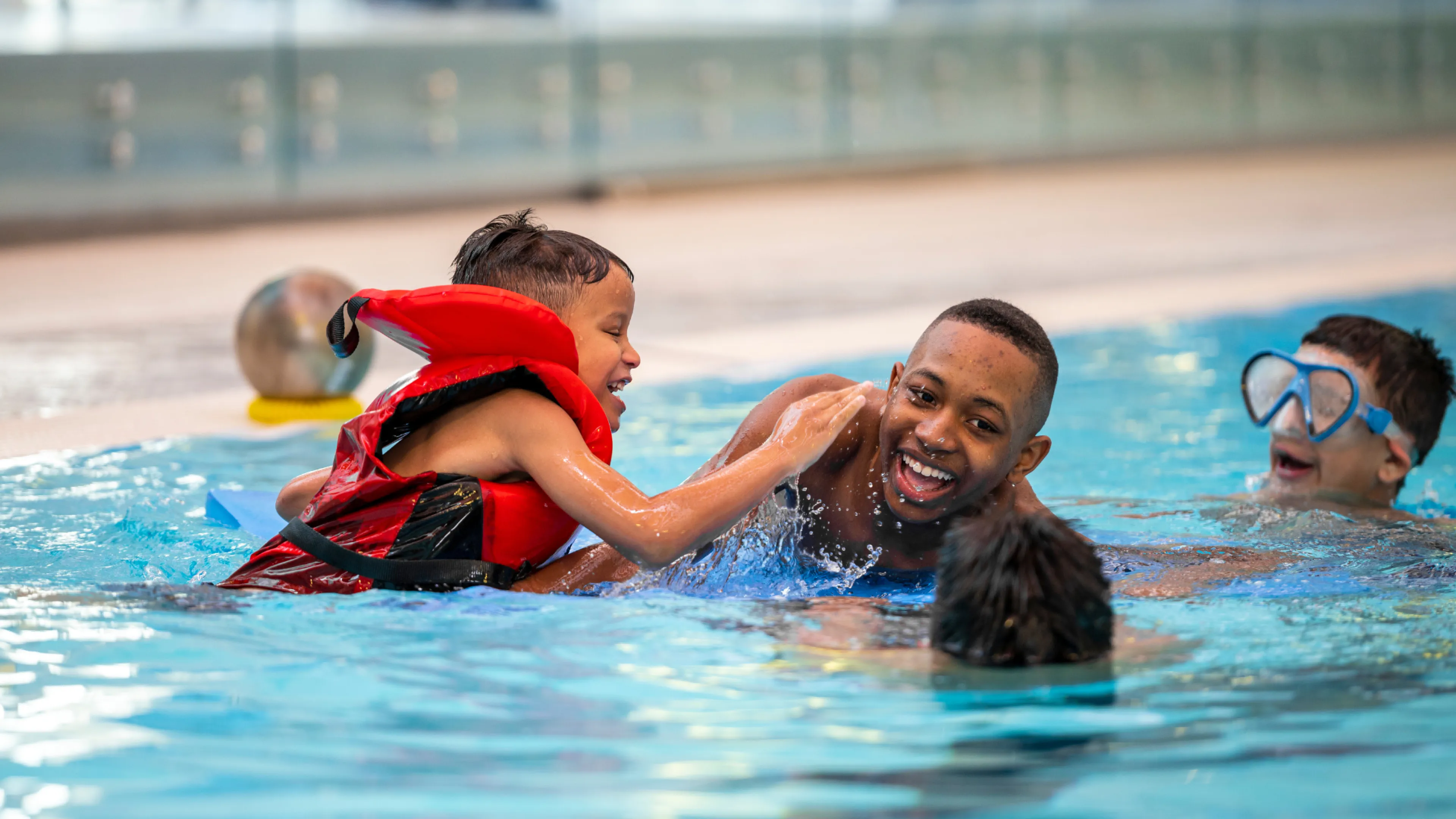 Group of boys swimming in the pool