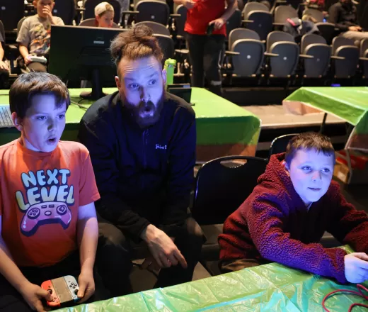 Youth and instructor playing video games