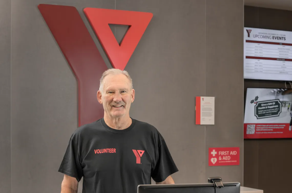 Volunteer standing in the lobby