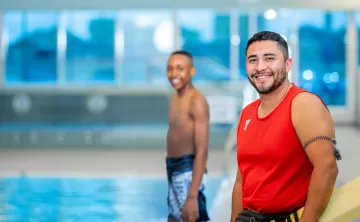 Lifeguard and kid at the pool